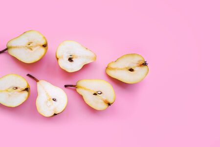 Fresh juicy pear on a pink background. Ripe fruits. Concept of healthy eating.の写真素材