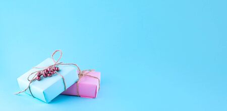 Two gift boxes of pink and blue. Place for text.