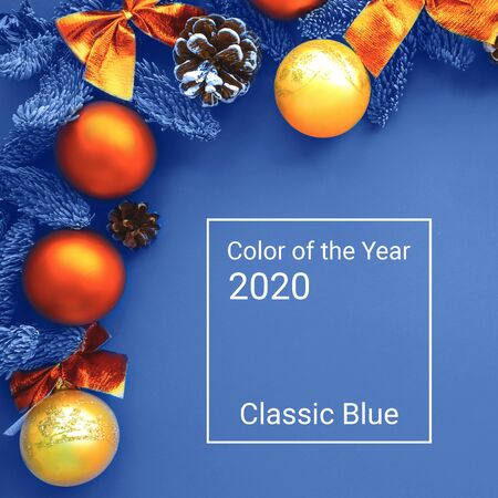 Christmas composition. Background blue colors with orange decorations.の写真素材