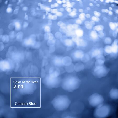 Abstract background of glitter and foil hologram. The color of the year 2020.