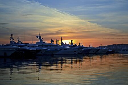 sunset behind the boatsの写真素材