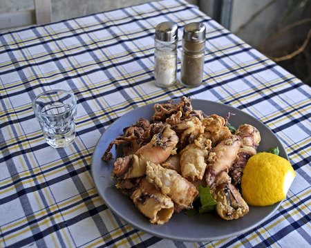 a plate with squid in a greek tavern