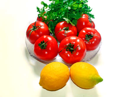 yellow lemons red tomatoes and parsley vegetables icon healthy diet conceptの写真素材
