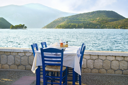 greek tavern in front of the sea at Ithaca island Greeceの写真素材