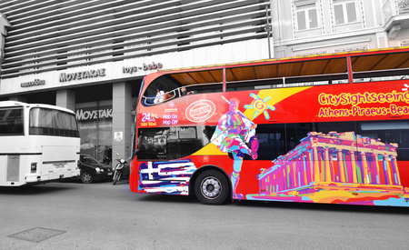 MONASTIRAKI ATHENS GREECE, FEBRUARY 18 2017: red double decker bus with tourists for sightseeing tour Monastiraki Athens Greece. Editorial use.のeditorial素材
