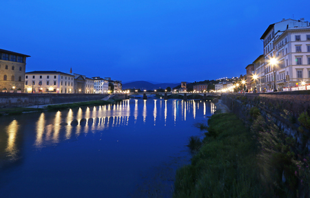 Blue hour photography - landscape of the Arno river of Florence or Firenze city Italyの写真素材