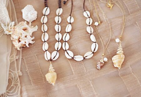 bohemian summer jewelry with shells - cowrie shells necklaces - fashion jewelry advertisementの写真素材