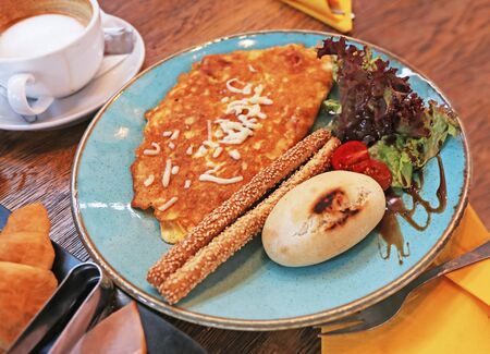 breakfast - brunch with omelette, salad and fresh bread - still life food photography