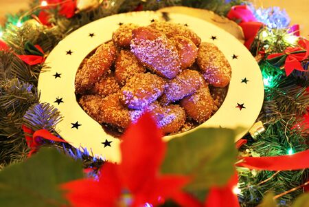 traditional greek melomakarona on the table - traditional greek cookies with honey and walnuts -...