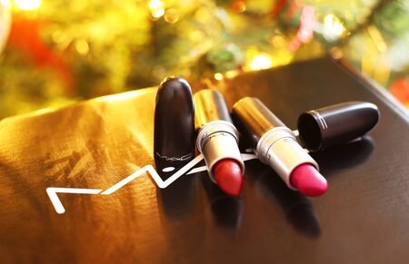 ATHENS GREECE, DECEMBER 28 2019: still life of MAC cosmetics famous brand in front of the Christmas tree - MAC lipsticks. Editorial use.のeditorial素材