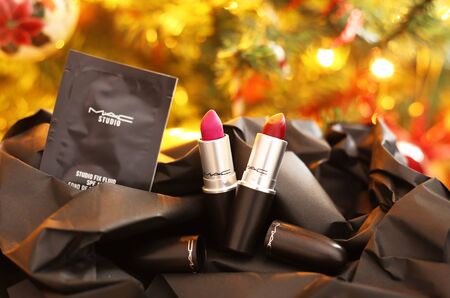 ATHENS GREECE, DECEMBER 28 2019: still life of MAC cosmetics famous brand in front of the Christmas tree - MAC lipsticks. Editorial use.のeditorial素材