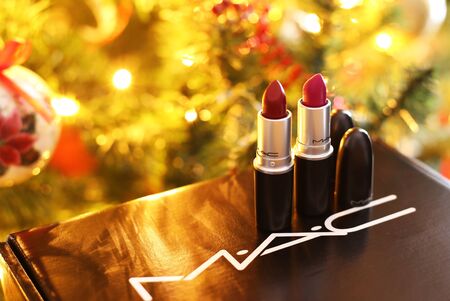 ATHENS GREECE, DECEMBER 28 2019: still life of MAC cosmetics famous brand in front of the Christmas tree - MAC lipsticks. Editorial use.のeditorial素材