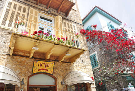 NAFPLIO GREECE, NOVEMBER 18 2018: traditional colorful buildings and bougainvilleas at Nafplio...