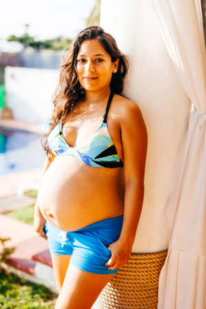 young pregnant latin womanの写真素材