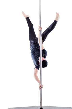 man performing pole dance. Studio shot, on white background, isolated cutの写真素材