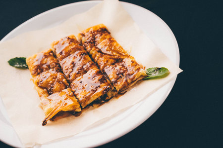 fresh rolled stuffed crepes on plateの写真素材