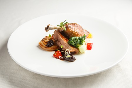 Well-browned and crisp duck confit with roast fennel, citrus fruit and prune sauce. Roasted duck...