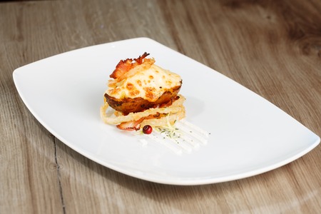 Hot rustic potato skins with cheese and bacon close-up on the table, horizontalの写真素材