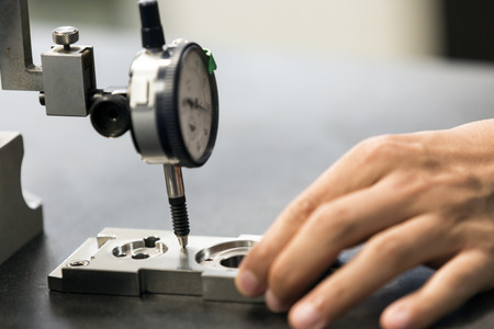 man use dial guage measure part precision