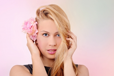 portrait of a beautiful girl with a flower in her hairの写真素材