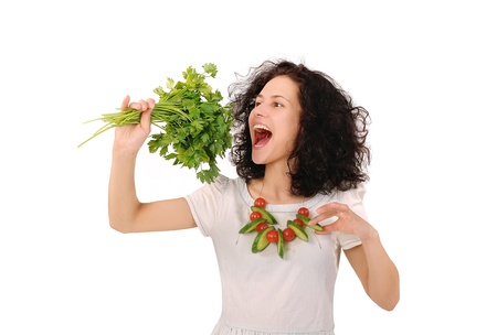 girl biting parsleyの写真素材