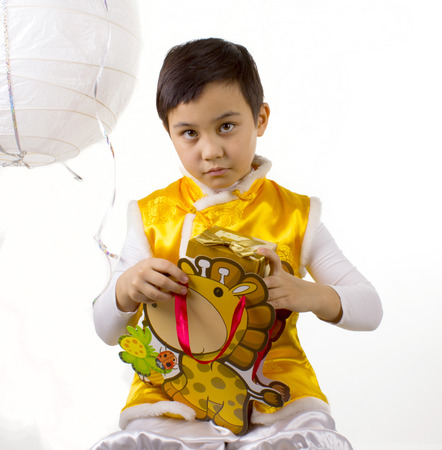 boy put box in gift bagの写真素材