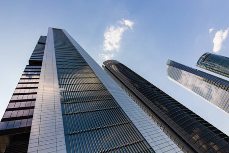 towers of business skyscrapers on the blue  sky with white clouds backgroundの写真素材