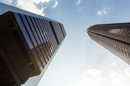 towers of business skyscrapers on the blue  sky with white clouds backgroundの写真素材