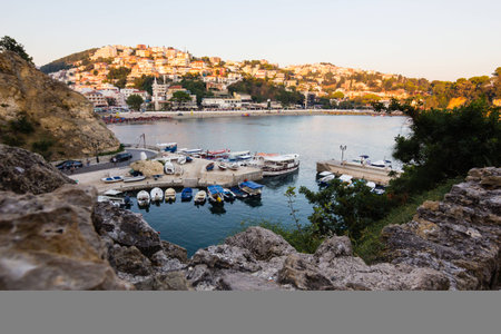 Boats at the small port in adriatic resort in old Ulcinj town in Montenegro during sunsetの写真素材