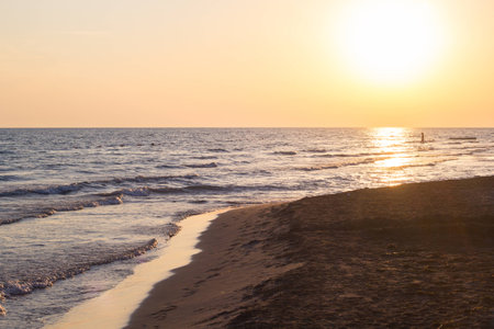 Beautiful blue waves of adriatic sea during sunsetの写真素材