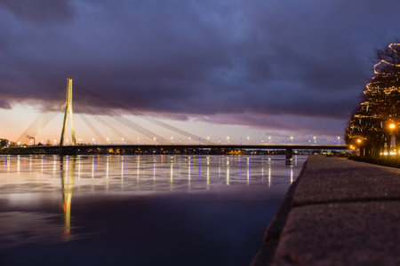 Cosmopolitan night cityscape of Baltic riverside in Riga, Latviaの写真素材