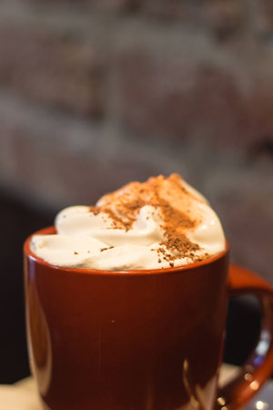 Coffe with whiped cream for breakfast with croissant in cafeの写真素材