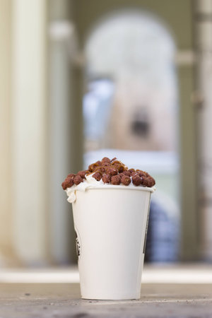 whiped cream and chocolate crisps on late coffe to goの写真素材