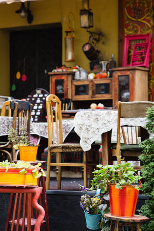Empty tables of outdoor cafe in city center of Lviv, Ukraine in Europe in autumnの写真素材
