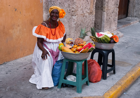 CARTAGENA, COLOMBIA - June 17, 2009: Palenquera woman sells fruits at Plaza Santo Domingo  in Cartagena, Colombiaのeditorial素材