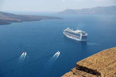 Cruise ship and two boats near Santorini. Greeceのeditorial素材