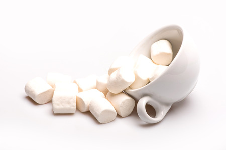 Marshmallows and coffee ?up on white background. Side viewの写真素材