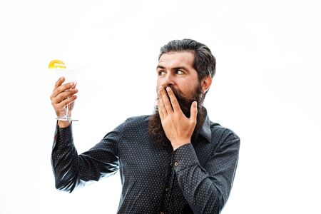 handsome bearded man with stylish hair mustache and beard on surprised face holding glass fo...