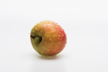 Natural fresh apple with drops isolated on white backgroundの写真素材