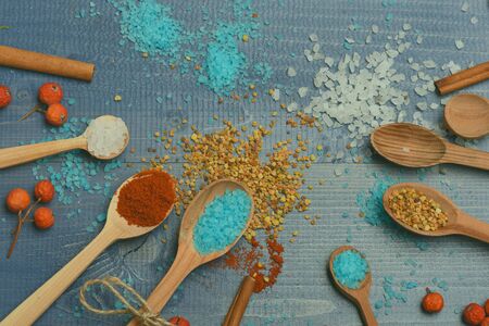 Ingredients for cooking of salt, cinnamon, anise, guelder rose, paprika and spices on vintage wooden...
