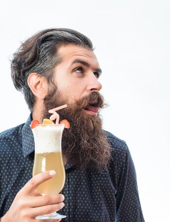 handsome bearded man with stylish hair mustache and long beard on dissatisfied face holding glass of...