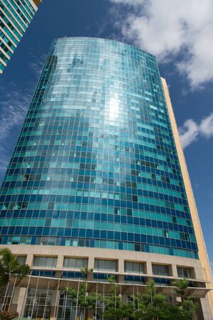Tall skyscraper or tower modern architecture building on city skyline on blue skyのeditorial素材