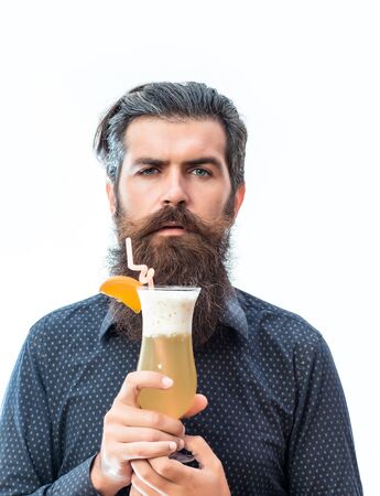 handsome bearded hipster with stylish hair mustache and long beard on serious face holding glass of alcoholic beverage isolated on whiteの写真素材