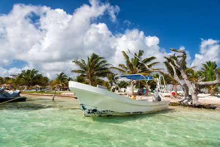 Mexico, Costa Maya - February 1, 2016: white motor boat in transparent blue sea or ocean water at...