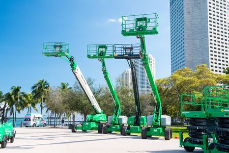Miami, USA - February 29, 2016: mobile industrial aerial work platforms or equipment with lifts on...