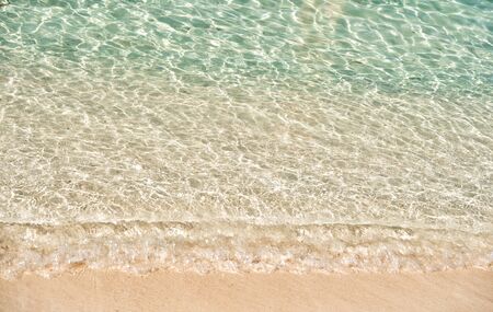 Beautiful marine view on sea coast line with clean wavy surf water on sandy beach at sunny day as...