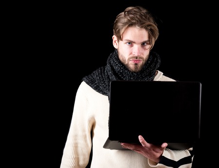 handsome bearded man or guy with beard on face in white sweater and knitted on black background...