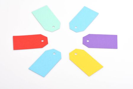 colorful empty paper shopping tag or blank cardboard label for price, sell, sale or holiday card isolated on white background, copy spaceの写真素材