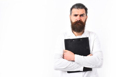 caucasian doctor or unshaven hipster, postgraduate student holding clipboard in medical gown isolated on white studio background. Medicine conceptの写真素材