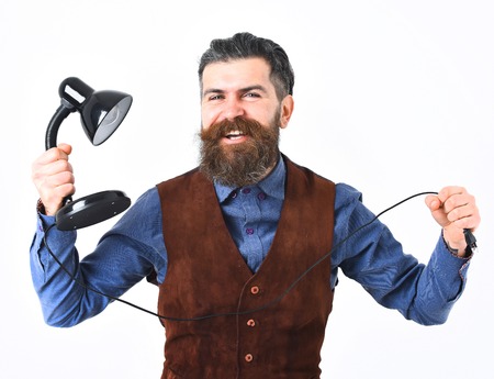 bearded man, long beard, brutal caucasian hipster with moustache holding table-lamp with happy face...